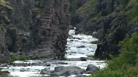 River through small canyon carved in volcanic rock Stock Footage 37301253
