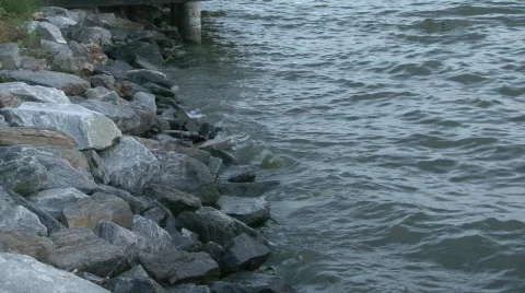 River tide against rocks Stock Footage 649581