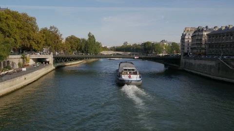 River Traffic underway passing under the Pont d'Arcole bridge Seine River Stock Footage 97669960