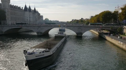 River Traffic underway passing under the Pont au Change bridge Seine River Stock Footage 97670679