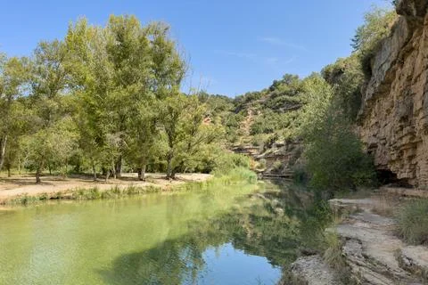 A river with trees on either side Stock Photos