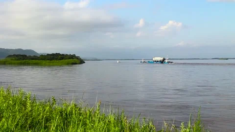 River tug pulls the barge with great equipment Stock Footage 100452870
