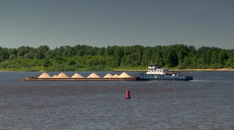 River tug pushing a loaded barge Stock Footage 64775428