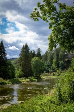 A river with a turn in the middle of the forest and the mountains, It really  Stock Photos