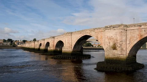 The River Tweed flows under the Berwick Bridge-Berwick-upon-Tweed England Stock Footage 96401489