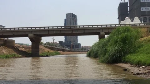 River Under Bridge in Phnom Penh Cambodia IMG 9860 Video stock 119893063
