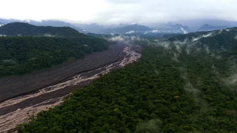 River Upano running through a broad riverbed surrounded by tropical forest Stock Footage 234996127