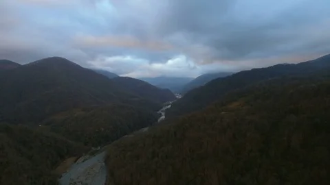 River valley among mountain in evening aerial view Stock-Footage 84777155