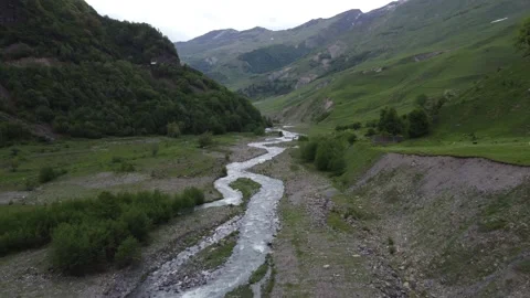 A river in a valley between the mountains Stock Footage 199394227