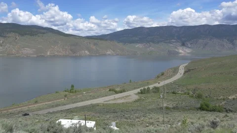 River in the valley with highway on the side. 스톡 동영상 75722794