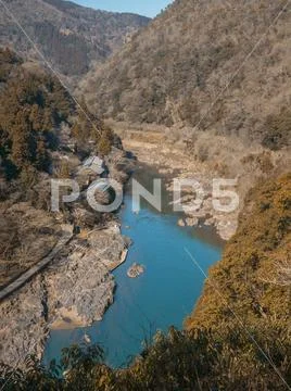 River in valley in the middle of the forest at autumn Stock Photos
