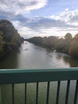 River View from a Bridge with Blue Sky and Green Trees Fotos Stock