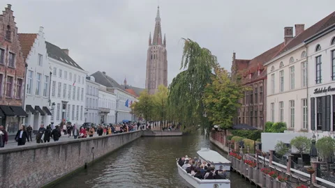 River view of De Dijver Park and Church of Our Lady, Bruges, Belgium Video stock 290211148