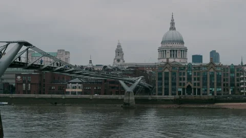 River view of Millennium bridge with St Paul’s Cathedral in background Stock Footage 130980018