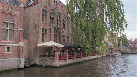 River view of Nepomucenus Bridge from De Dijver Park, Bruges, Belgium Stock Footage 290209582