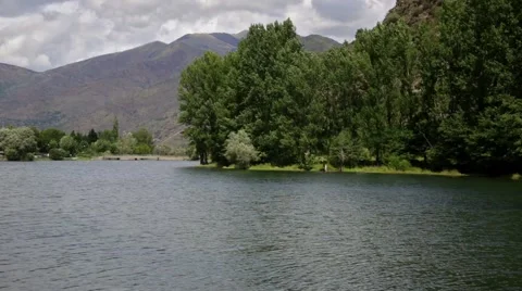River view with trees and the water surface moved by the wind. Time Lapse Stock Footage 56525843