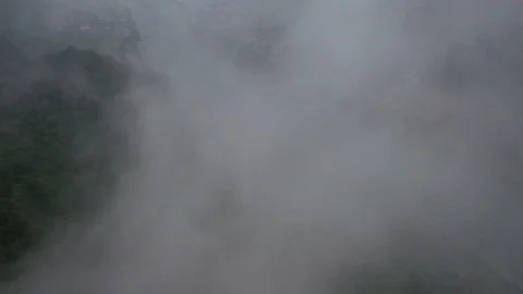 River Vilage Revealed Through Clouds Drone Video Stock Footage 125550976