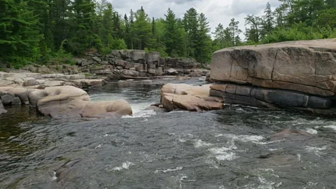 River water cascading over the edge of Pabineau Falls, New Brunswick, Canada Stock Footage 147906987