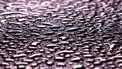 River of water drops on black surface, going far away Stock Footage 78111654