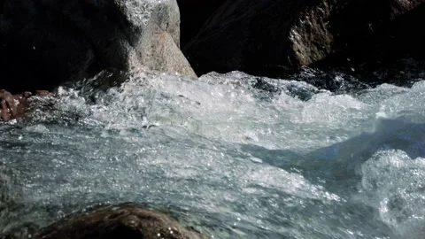 River with water flowing between rocks. Beautiful and relaxing view, with strong Stock-Footage 142507903