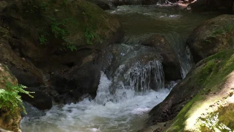 River water flowing between rocks Stock Footage 200699365