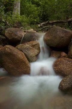 River water flowing between the rocks Stock Photos