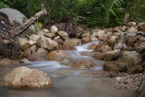 River water flowing between the rocks Stock Photos