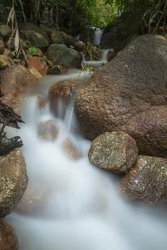 River water flowing between the rocks Stock Photos