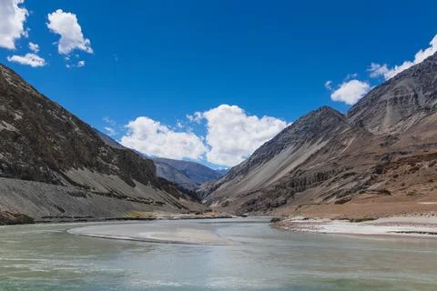 River water flowing at confluence of the Indus and Zanskar Rivers, known as S Stock Photos