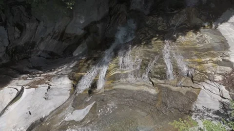 River water flowing down a  beautiful rock face in the forest Stock Footage 288718922