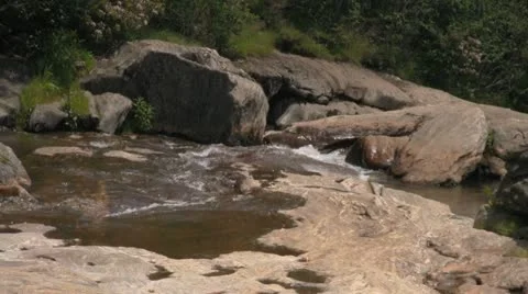 River Water Flowing Down From Mountain Over Stone and Rock Video stock 12763571