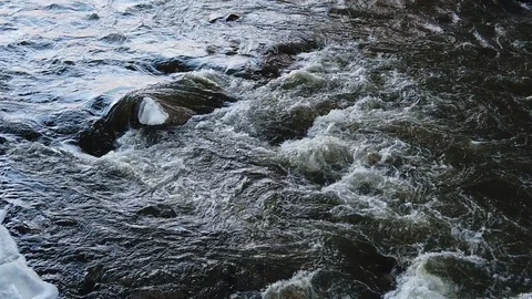 River water flowing over rocks Stockbeeldmateriaal 102583245