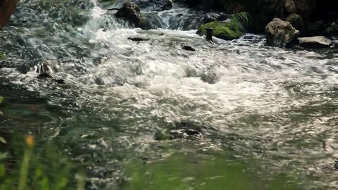 River Water Flows Among Rocks And Stones Of River Stock Footage 76939177