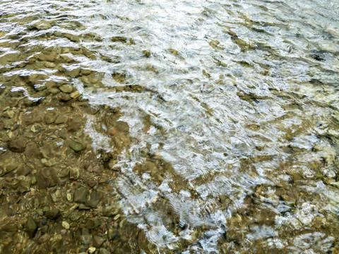 River Water Flows Slowly Over Gravel Stock Photos