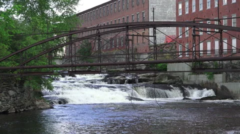 River Water Rushing Past Brick Factory And Steel Bridge Stock-Footage 52002174