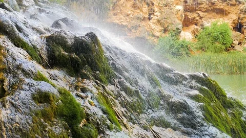 River waterfall falling on rock in slow motion Stock Footage 124389560