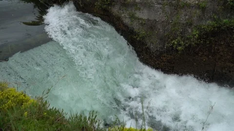 River waterfall - flowing and splashing water in cold river Video stock 92691153