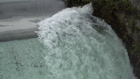 River waterfall - flowing and splashing water in cold river Stock Footage 92854635