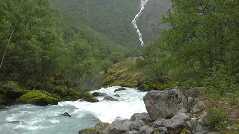 River waterfall forest mountains atmospheric pan up Stock Footage 77338243