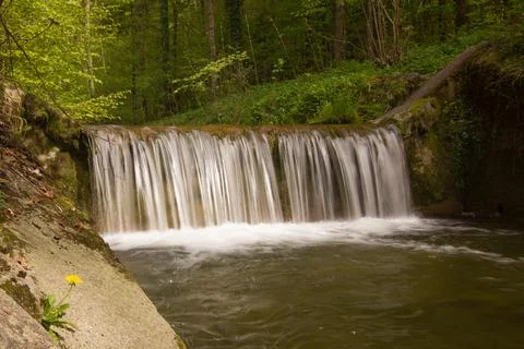 River waterfall (grey filter) in a forest on a summer day Stock Photos