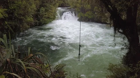 River waterfall with a swing in the foreground Stock-Footage 118291737