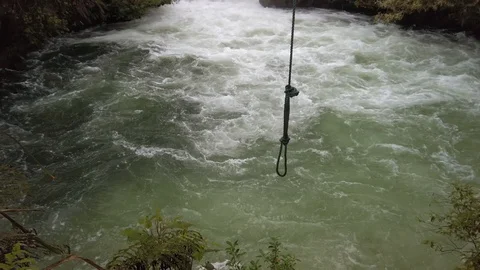 River waterfall with a swing in the foreground Video stock 118291816