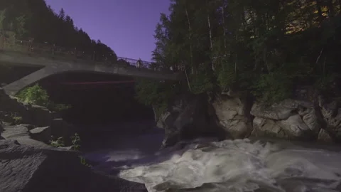 River waterfall at winter with Bridge NIght Timelapse Video stock 160771377