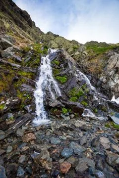 River watterfall flowing over rough rocks Stock Photos