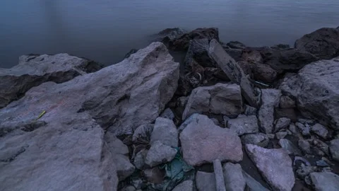 River Waves Crashing Against Rocks on the Bank Time-lapse Stock Footage 326706484