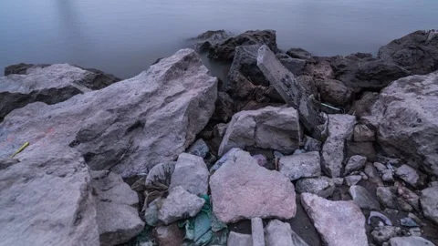 River Waves Crashing Against Rocks on the Bank Time-lapse Stock Footage 326706505