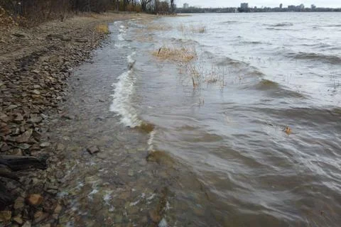 River waves flowing onto the shore Stock Photos