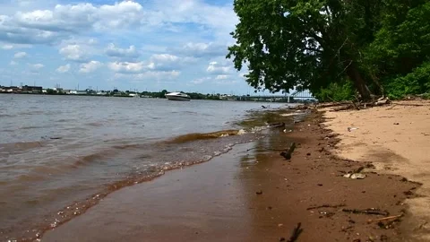 River waves on sandy beach 3 with boat Stock Footage 246943164