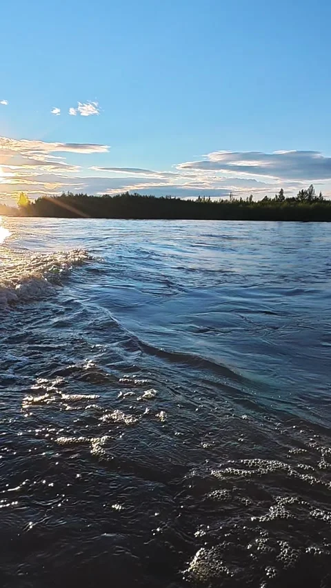 River Waves at Sunset with Forest and Mountain Background Stock Footage 341420123
