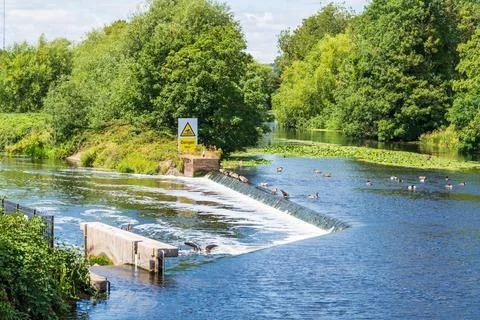A river weir between the River Tame and Anker in Tamworth, UK Stock Photos
